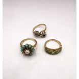 Three vintage 9ct yellow gold gem set rings, a Victorian style carved half hoop peridot set ring