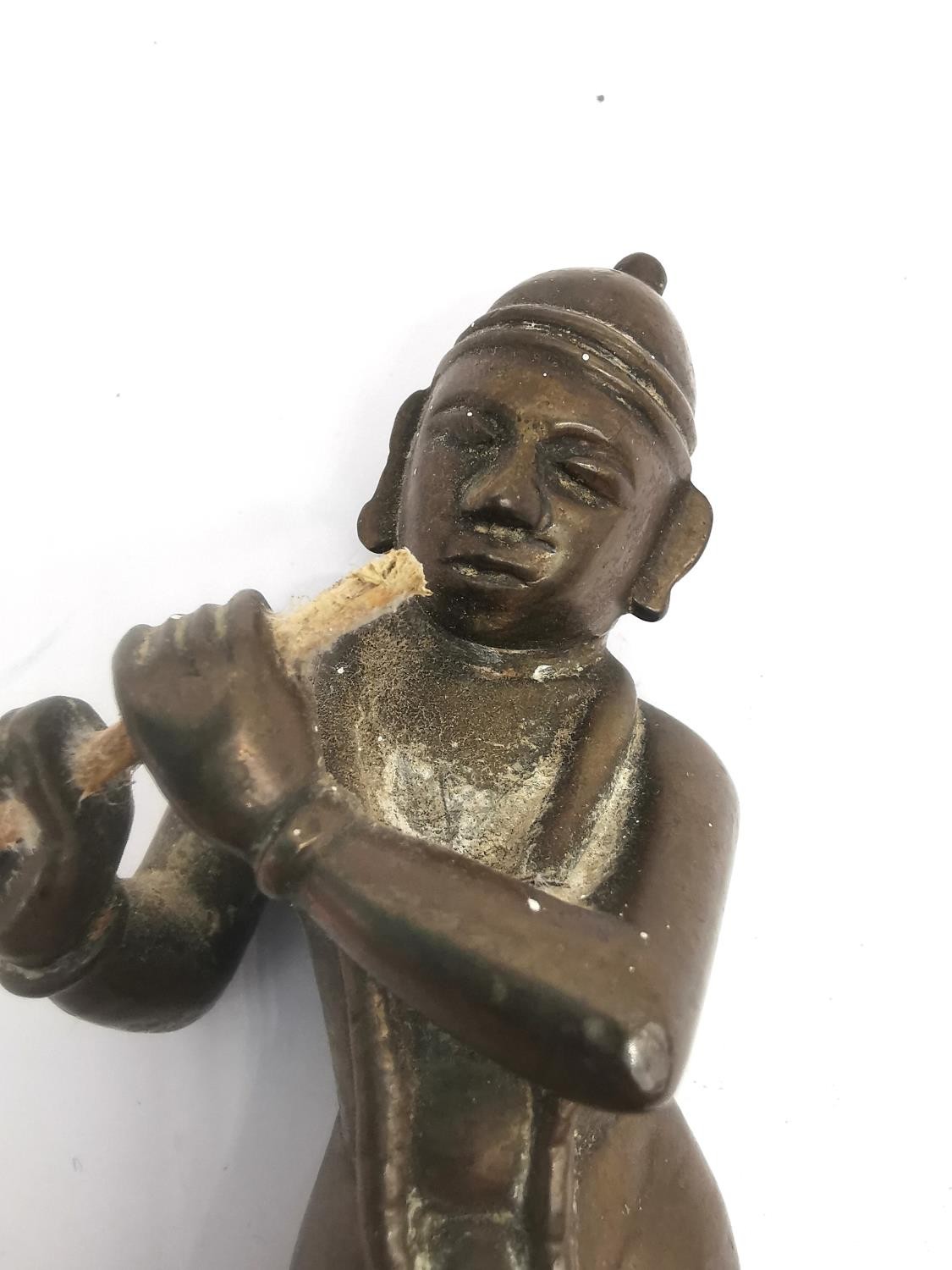 A 19th century Indian bronze figure of Krishna in Tri-bhang stance and playing the flute. H.12.5cm. - Image 3 of 8