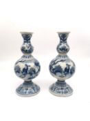 Gerrit Pietersz Kam, a pair of late 17th/early 18th century Delft double gourd blue and white