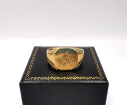 An early 20th century 9ct yellow gold masonic signet ring by Marple's and Co with engraved square