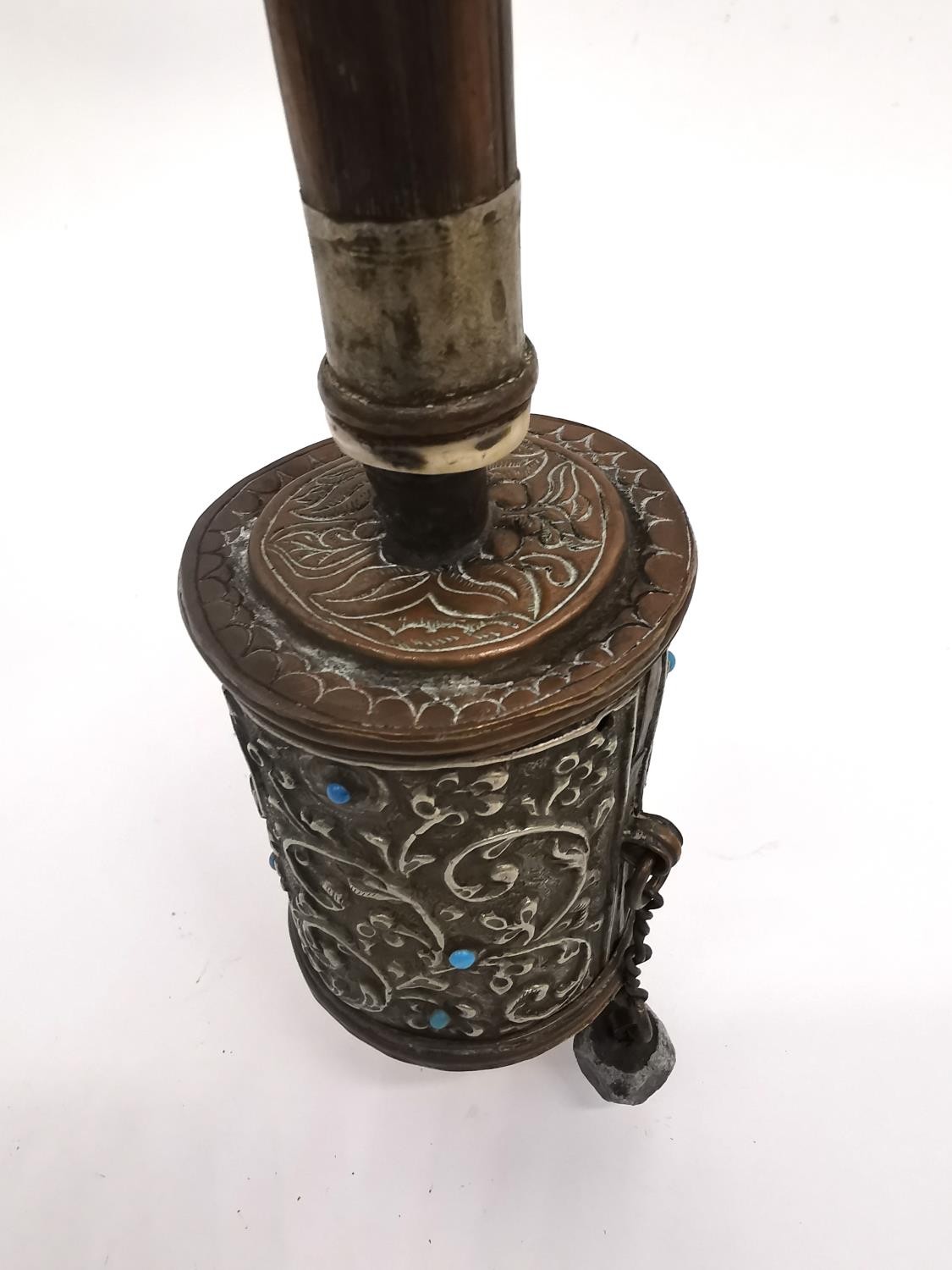A Tibetan 19th century brass and copper repousse prayer wheel with hardwood handle. H.31cm. - Image 4 of 5