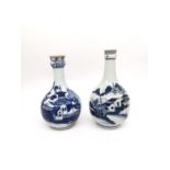 Two 18th century Chinese blue and white bottle vases with pagoda and mountain landscape design. H.