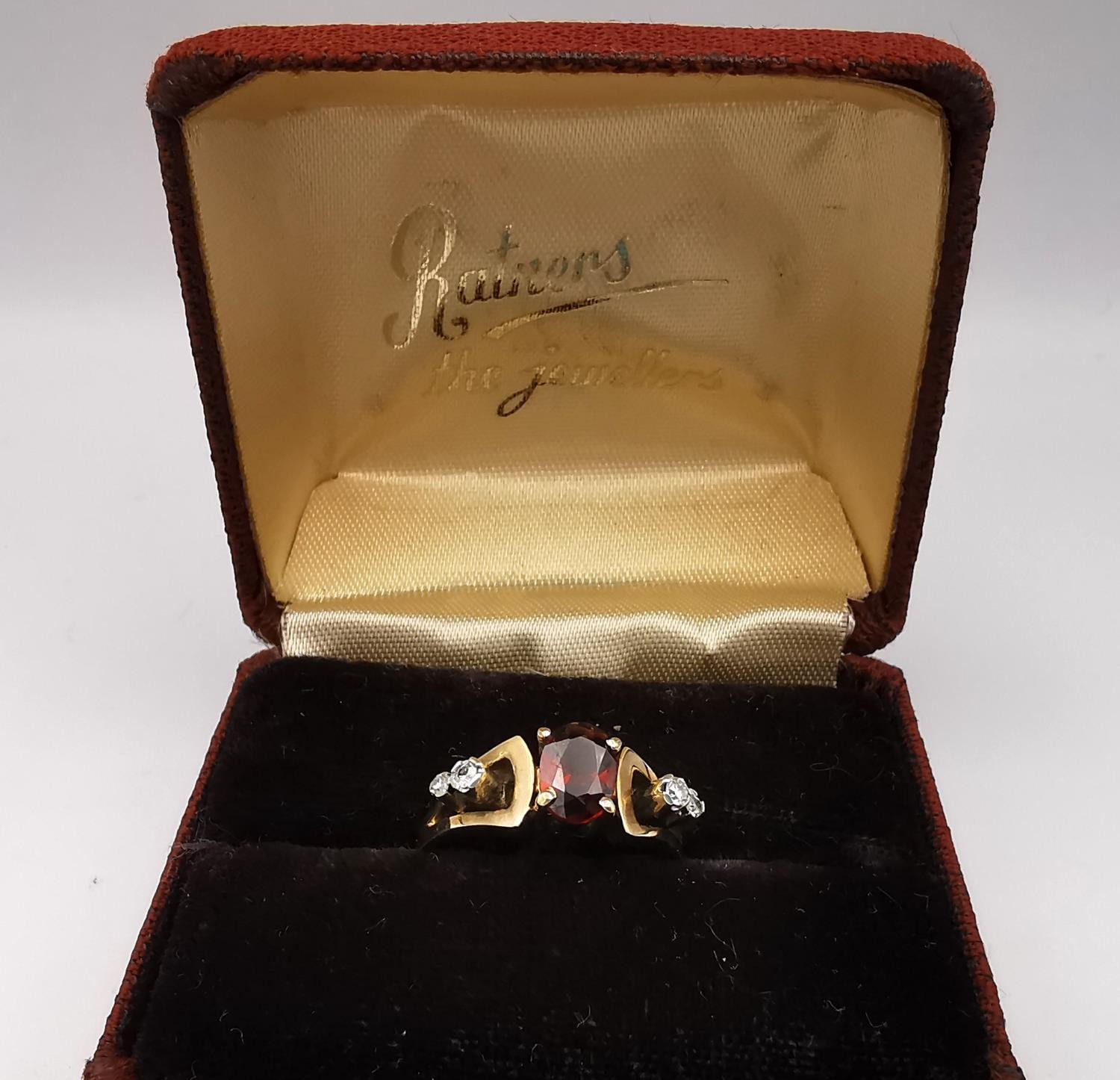 A boxed 1970's 9ct yellow gold sculptural design garnet and diamond dress ring, set to centre with - Image 2 of 4