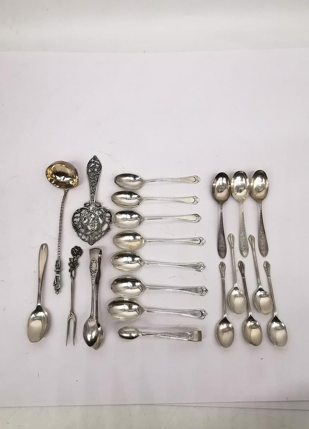 A collection of silver teaspoons, two pairs of sugar tongs, a pickle fork, a small sauce ladle and a - Image 3 of 16