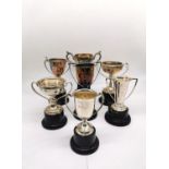 A collection of seven silver golfing competition trophies with inscriptions. Various makers. Tallest