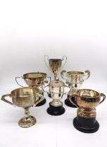 A collection of six silver golfing presentation trophies. Each inscribed with the competition and
