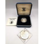 A silver swiss National Exhibition medal dated 1964 and a cased silver proof one pound coin with