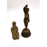 A 19th century gilt bronze putti on ebonised base along with brass seated Buddha. Tallest 14cm.