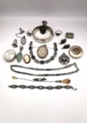A collection of silver jewellery, including two silver pill boxes one with a encased dried four leaf