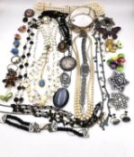 A large collection of miscellaneous costume jewellery, including a boxed Lotus pearl choker with