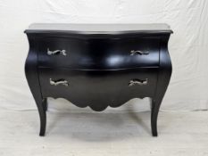 A contemporary ebonised bombe form commode chest. H.88 W.120 D.55cm.