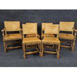 A set of six mid century oak framed dining chairs in the Jacobean style. Upholstered in leather to