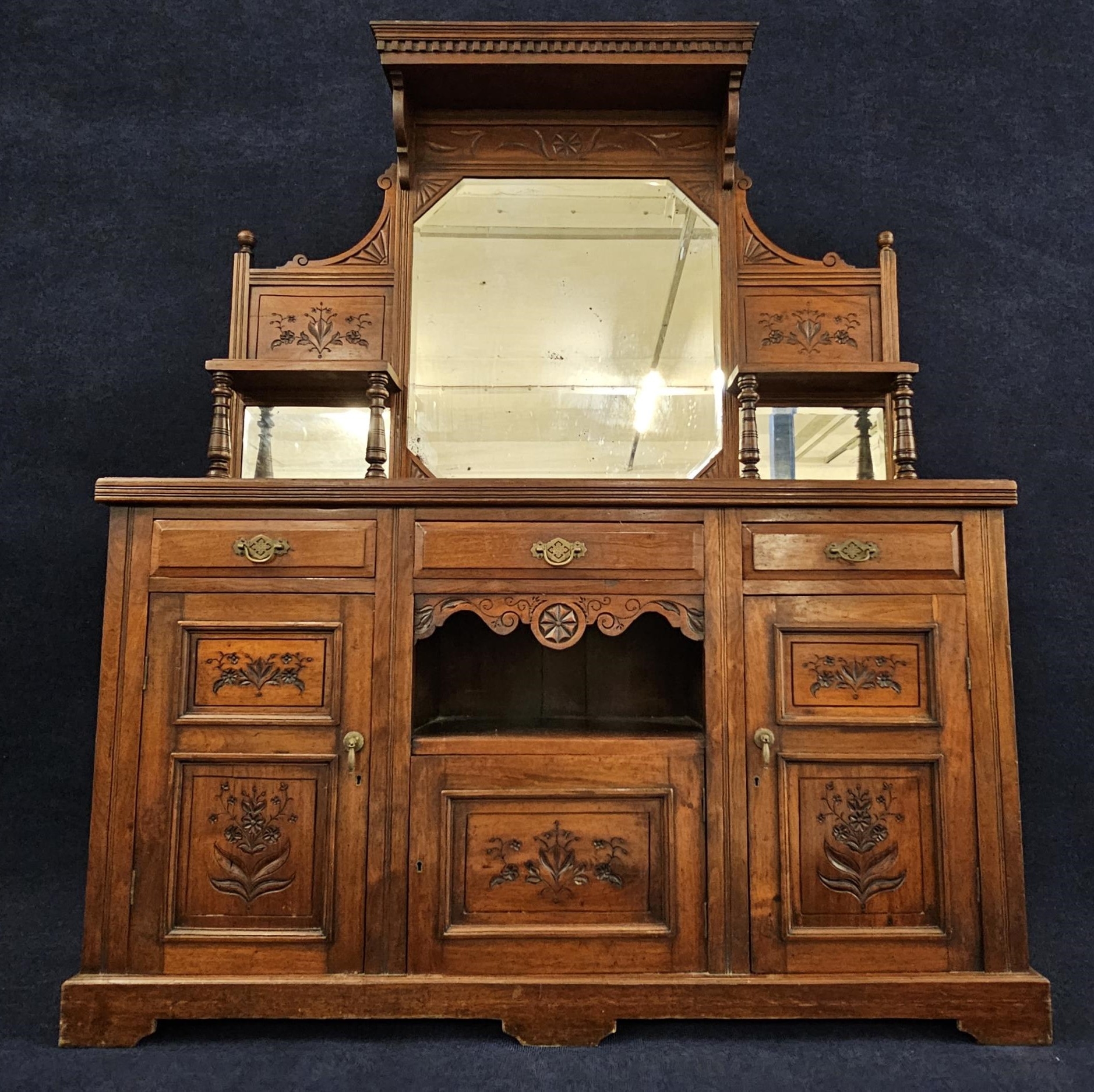 A late Victorian walnut sideboard. H.188 W.150 D.46cm.