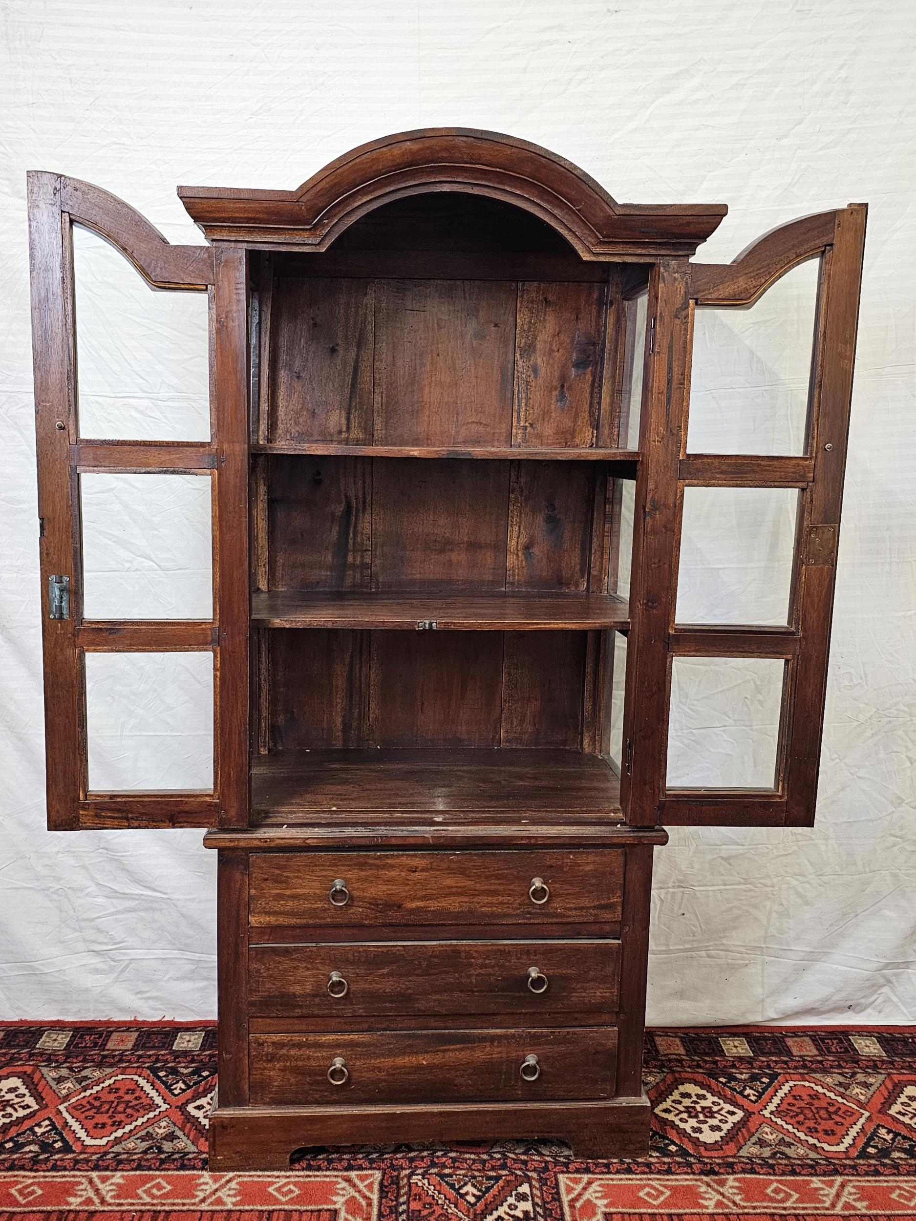 An Eastern teak bookcase cabinet fitted with drawers to the base. H.160 W.78 D.44cm. - Image 4 of 6