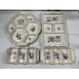 A collection of four Poole pottery hors d'oeuvres dishes. Largest W.33cm.