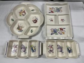 A collection of four Poole pottery hors d'oeuvres dishes. Largest W.33cm.