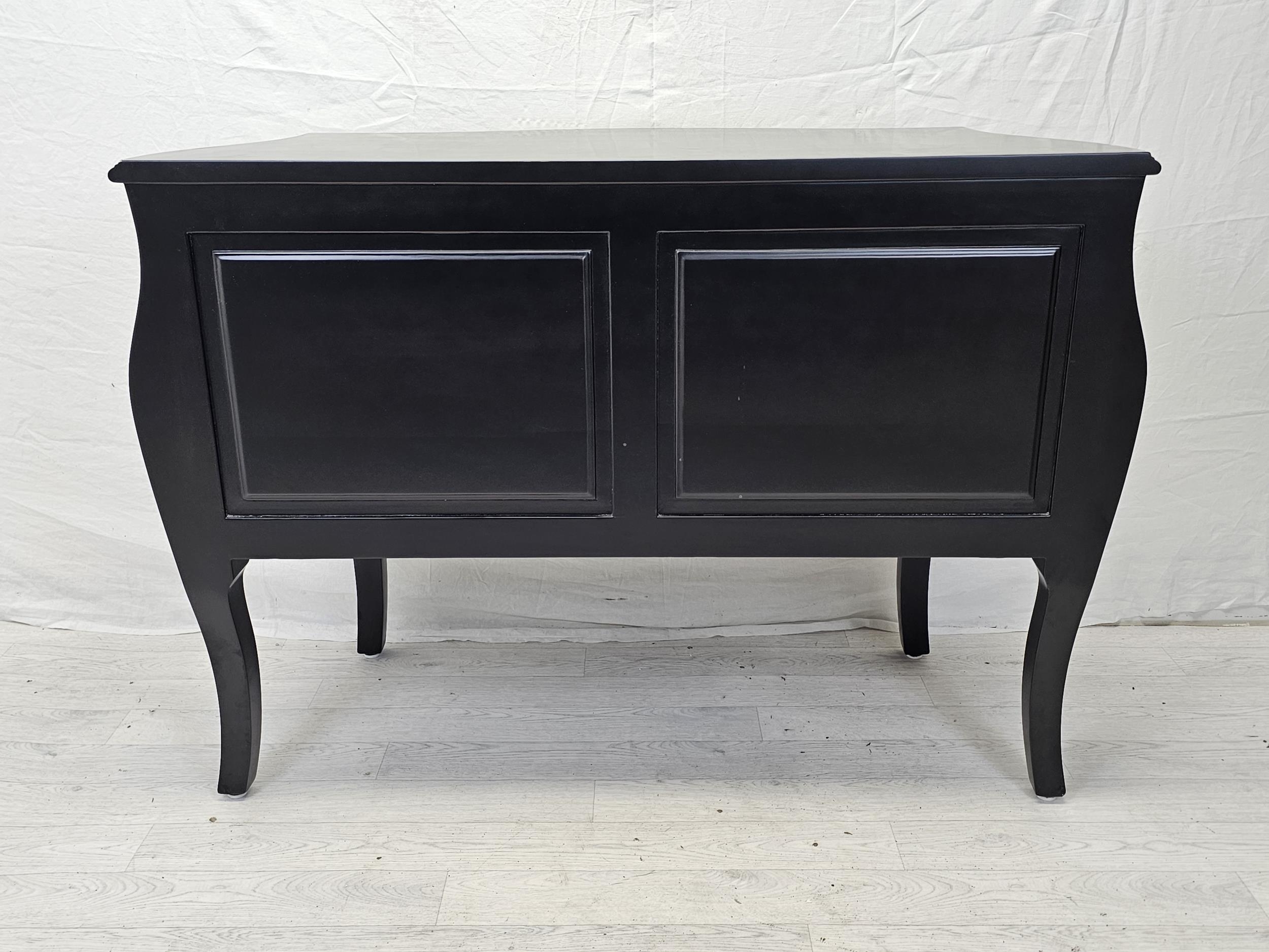 A contemporary ebonised bombe form commode chest. H.88 W.120 D.55cm. - Image 7 of 7