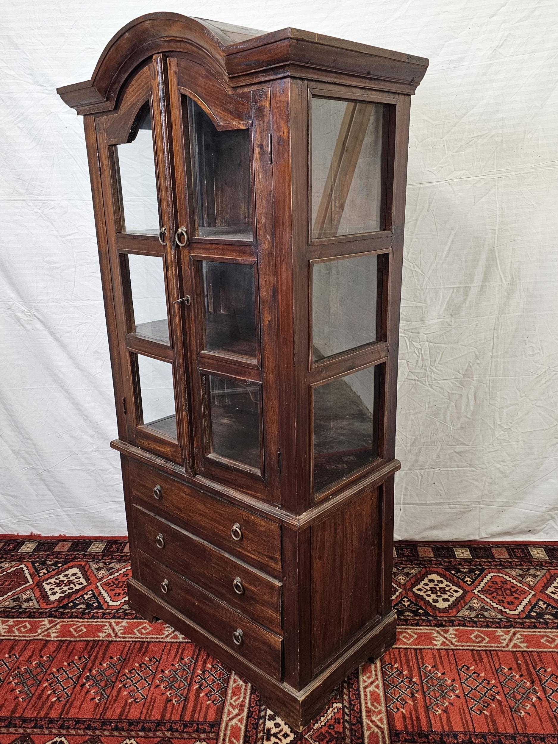 An Eastern teak bookcase cabinet fitted with drawers to the base. H.160 W.78 D.44cm. - Image 2 of 6