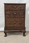 A small mid century oak chest of drawers. H.56 W.35 D.23cm.