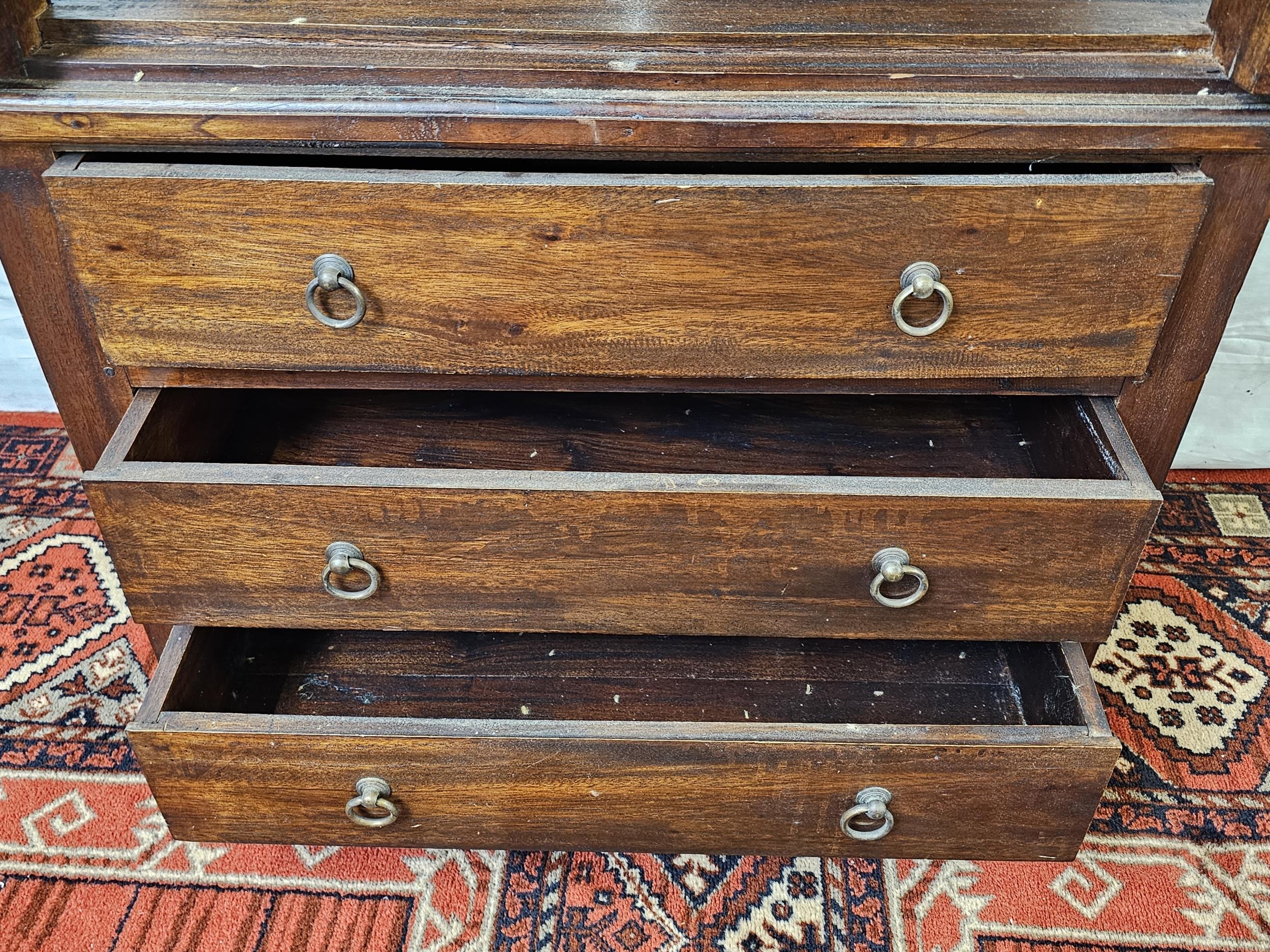 An Eastern teak bookcase cabinet fitted with drawers to the base. H.160 W.78 D.44cm. - Image 6 of 6