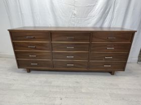 Sideboard, contemporary teak with a bank of twelve drawers. H.77 W.183 D.32cm.