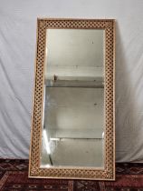 A contemporary carved and lacquered full height mirror, H.200 W.100cm.