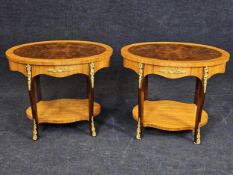 A pair of French style burr walnut lamp tables on cabriole supports with ormolu mounts. H.47 W.56
