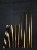 A collection of pool cues and rests. Longest is L.270cm.