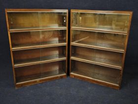 A pair of mid century teak Minty bookcases. H.120 W. 89 D.23cm.