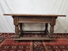 An 18th century continental elm side table with planked top on turned and stretchered base. H.78 W.