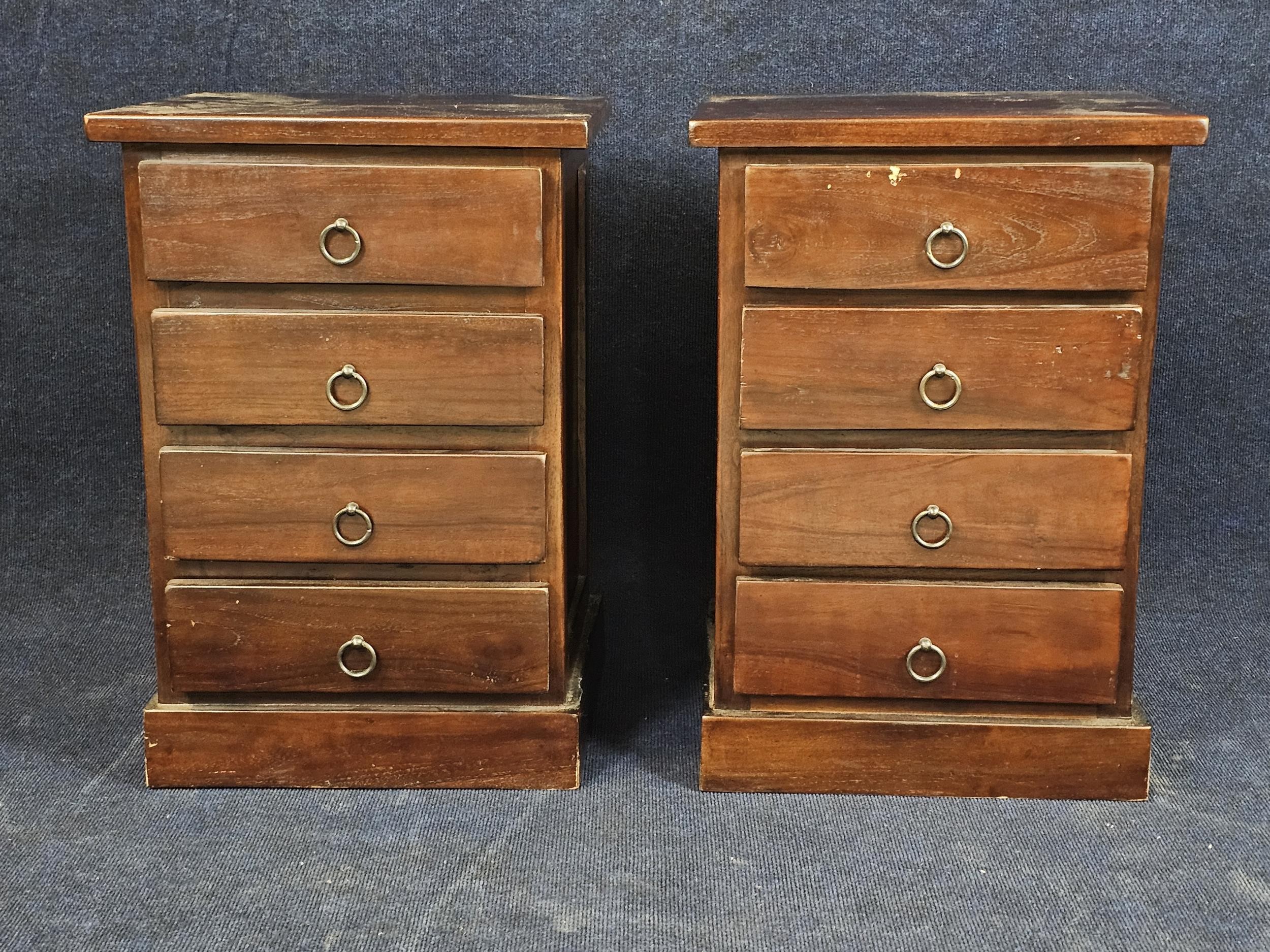 A pair of Eastern teak bedside cabinets. H.66 W.45 D.40
