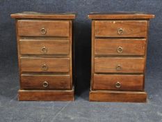 A pair of Eastern teak bedside cabinets. H.66 W.45 D.40