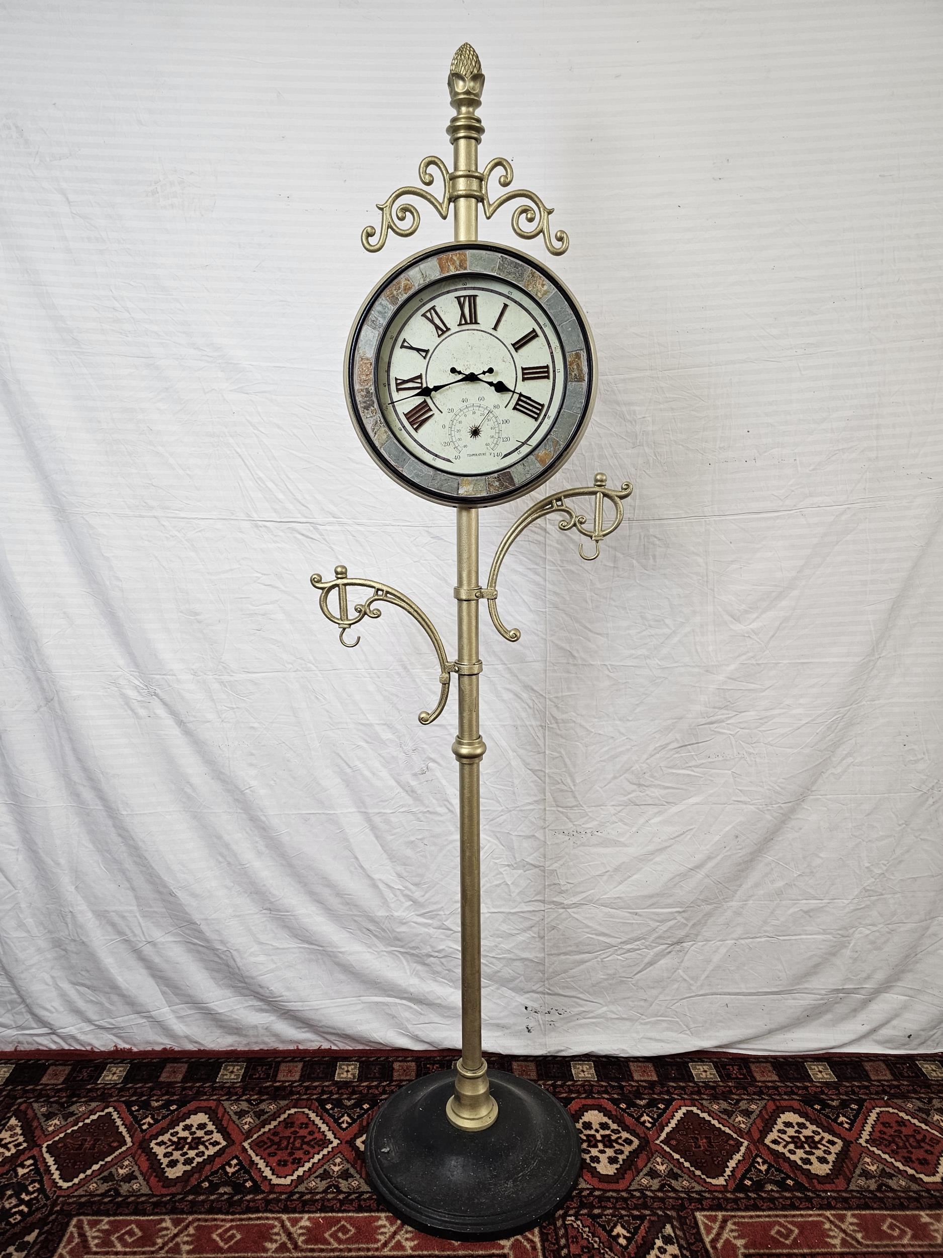 A Victorian style full height clock thermometer with modern battery powered movement. H.195cm.