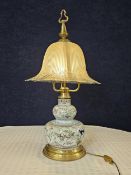 A large Ceramic Faience Quimper style lamp with glass shade. H.86cm.