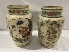 A pair of late 19th century Japanese vases. H.24cm.