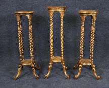 Three Eastern hardwood torcheres in the 19th century style. H.106 W.30 D.30cm.