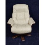 A contemporary Scandinavian leather upholstered armchair with reclining swivel action.