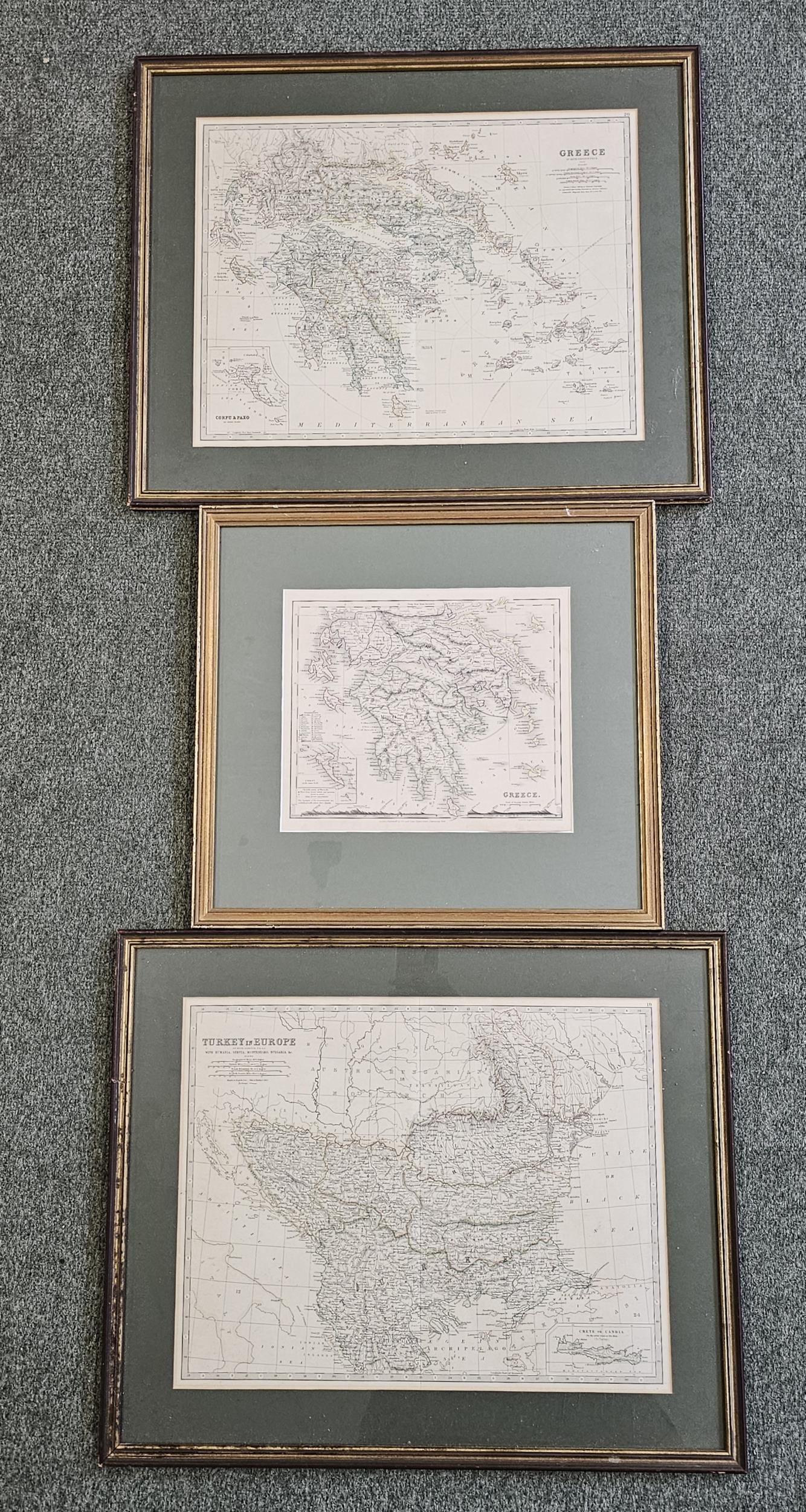 A pair of framed and glazed maps along with a similar map. Largest H.46 W.56cm.