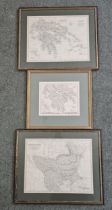 A pair of framed and glazed maps along with a similar map. Largest H.46 W.56cm.