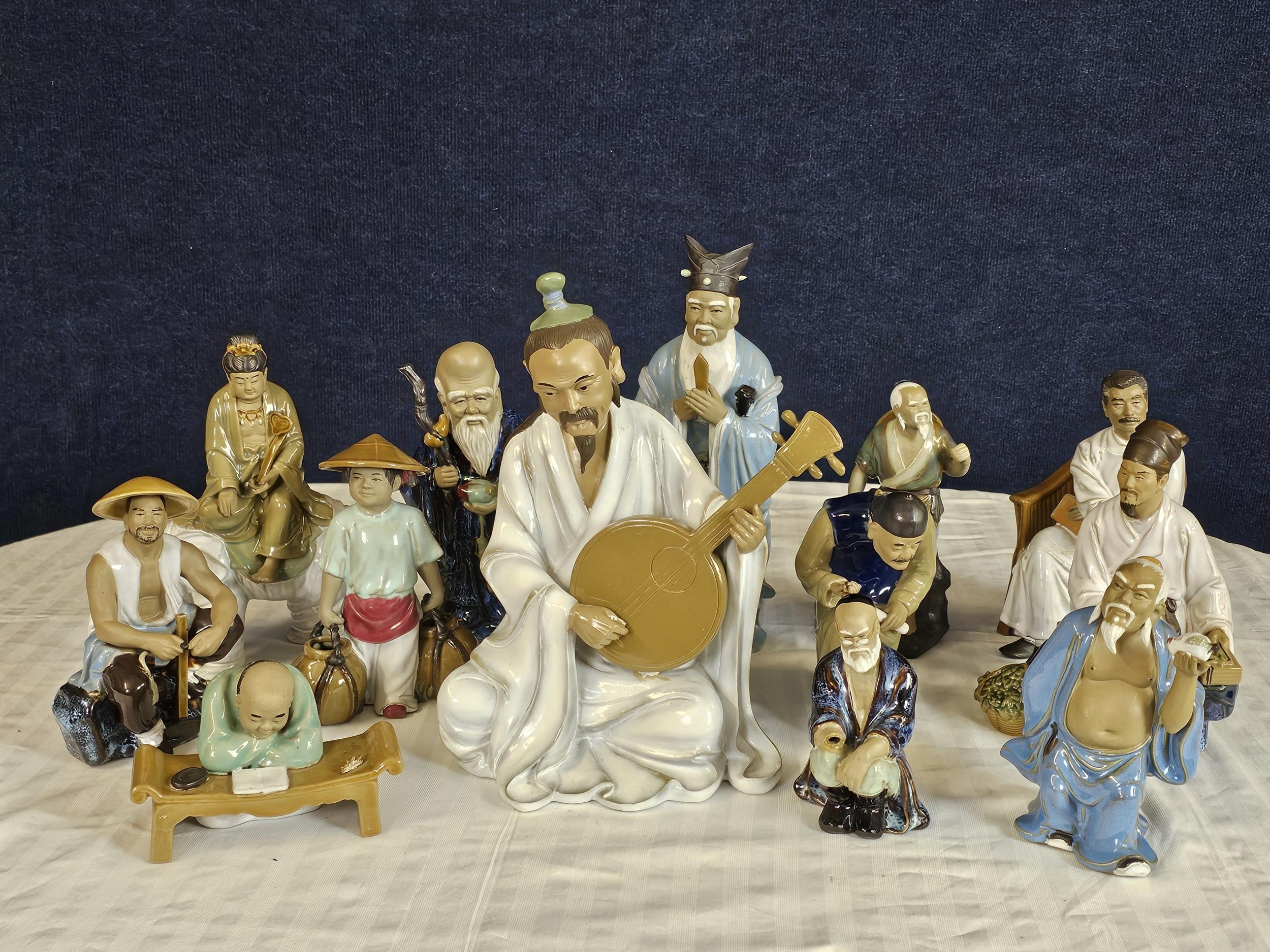 A large collection of Chinese Mudmen figures. Tallest is H.42cm. Most are in very good condition.