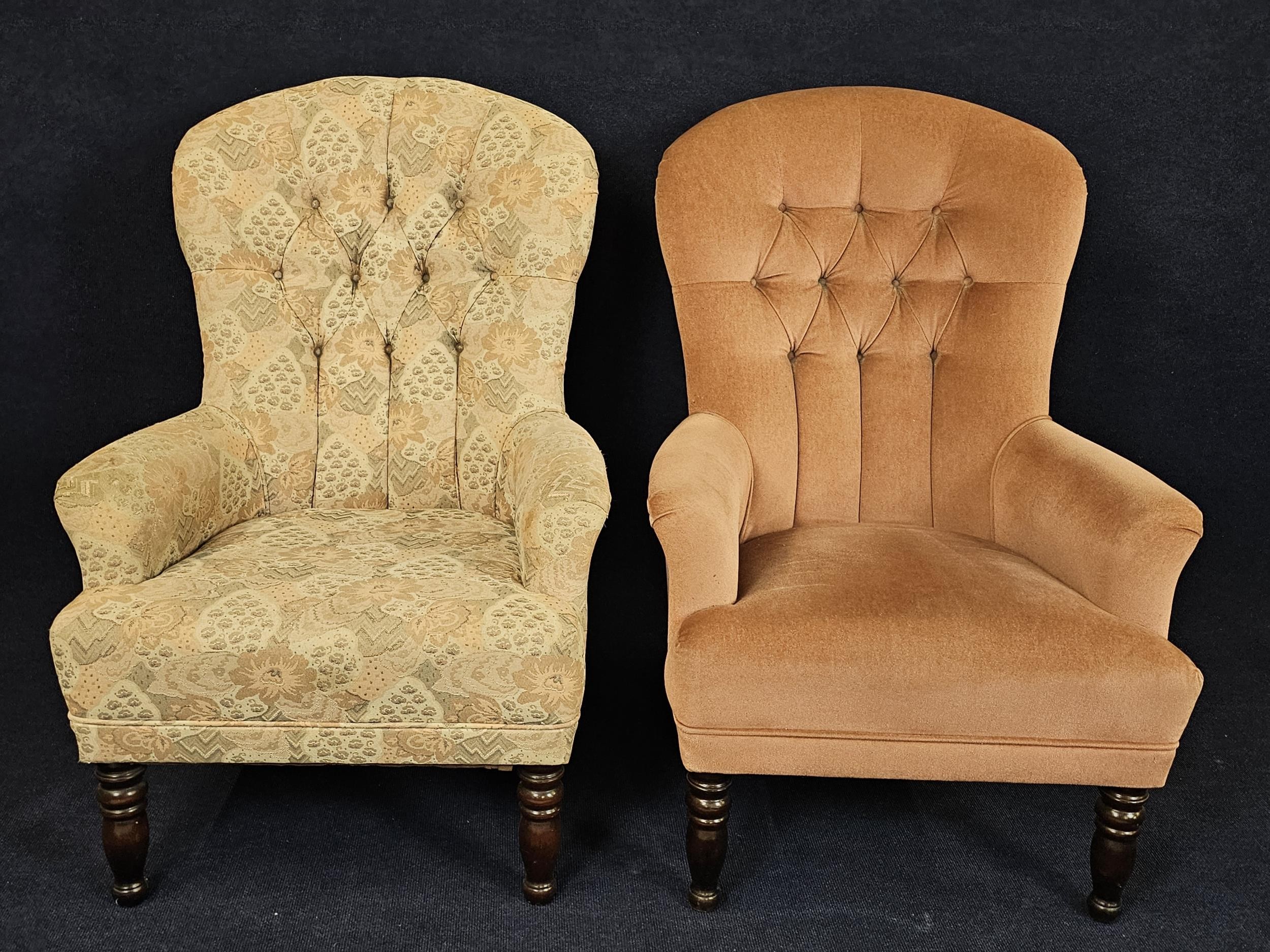 A pair of Victorian style armchairs in differing upholstery.