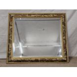 Wall mirror, contemporary with bevelled plate. H.64 W.74cm.