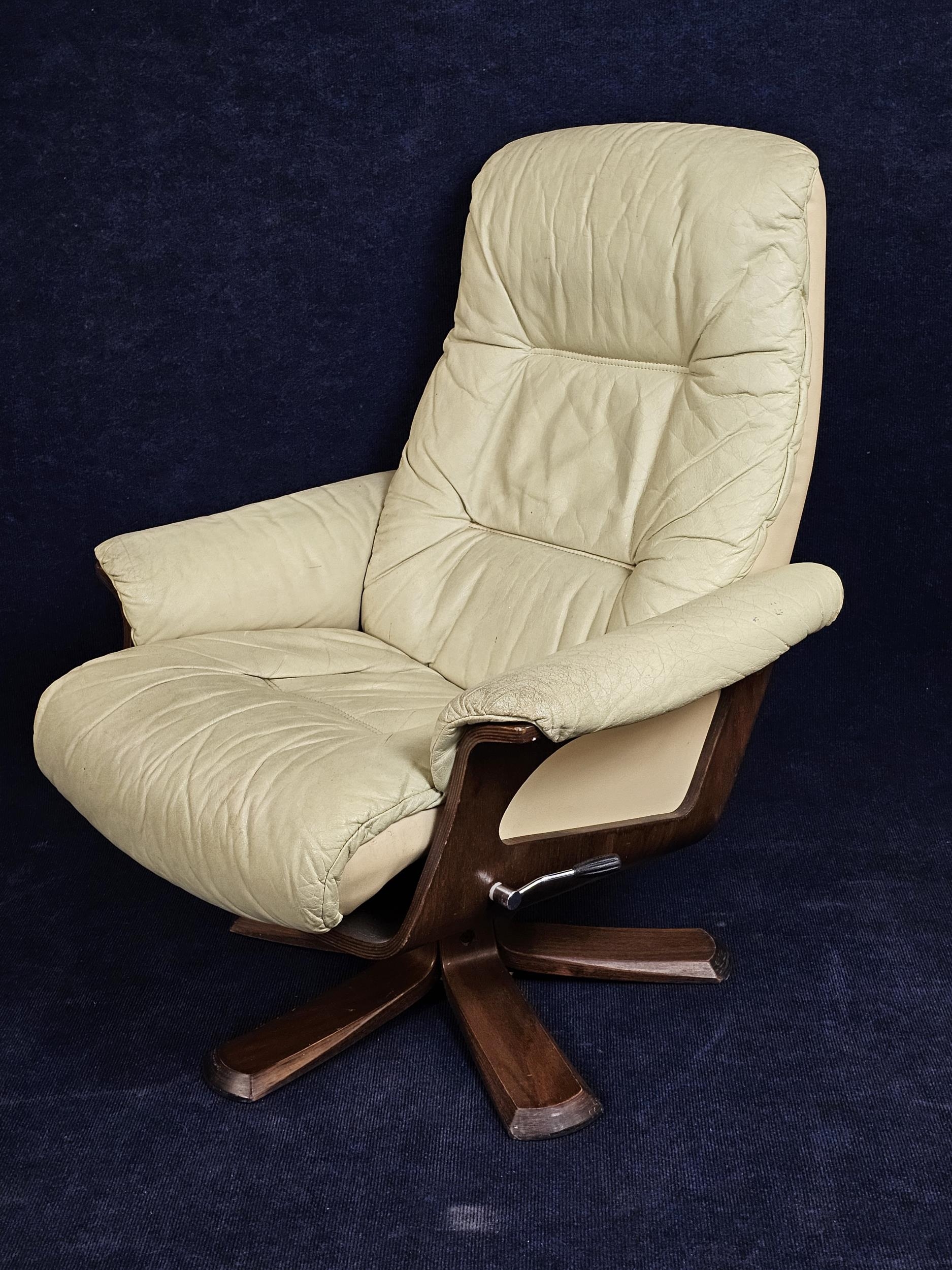 A contemporary Scandinavian leather upholstered armchair with reclining swivel action. - Image 2 of 3