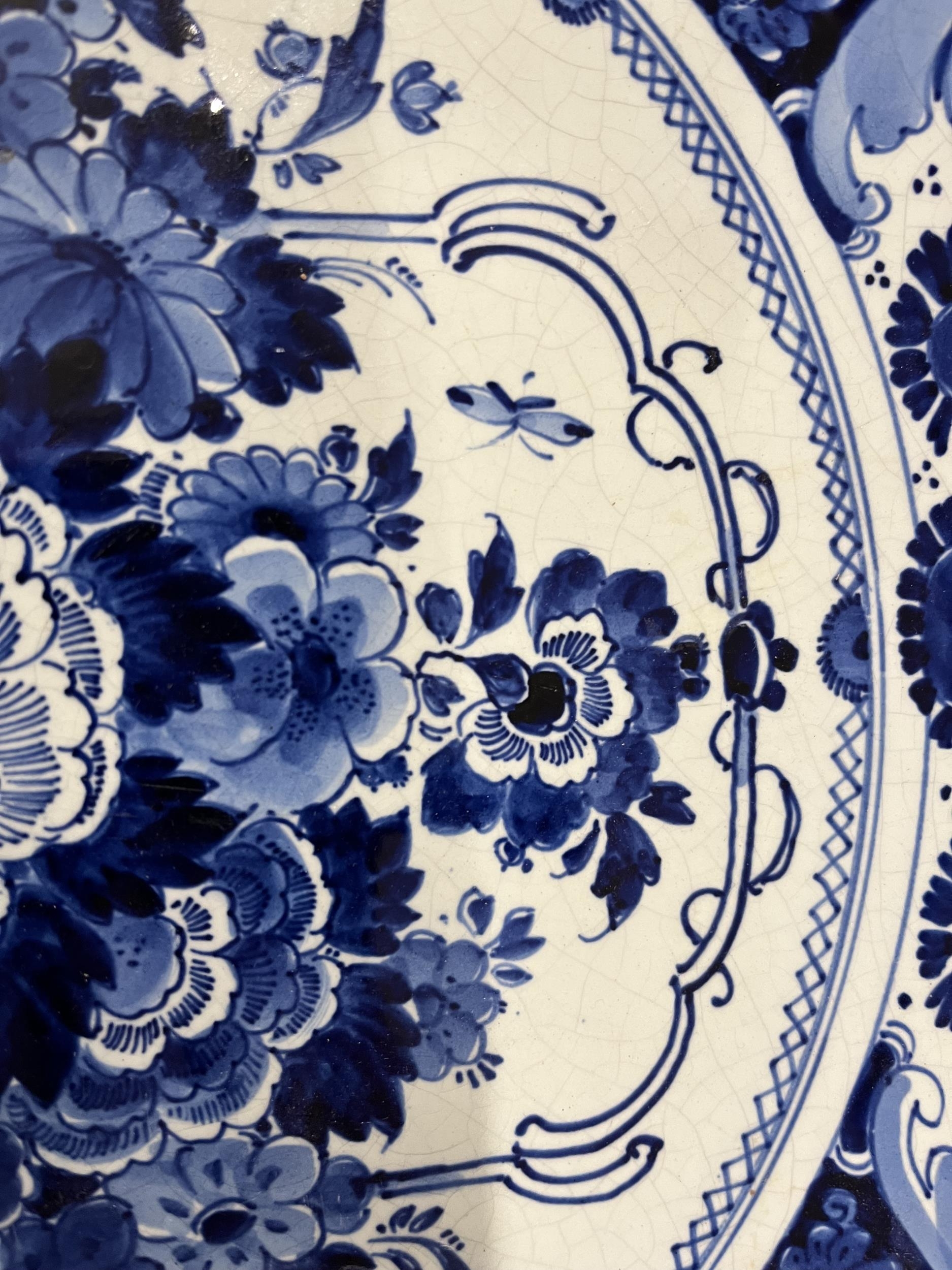 A Delft plate, C.1900, marked Joost Thooft and Labouchere to the underside. (Small hairline crack as - Image 5 of 5