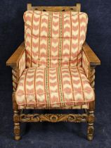 A mid century antique style oak armchair with adjustable back. H.98 W.64 D.90cm.