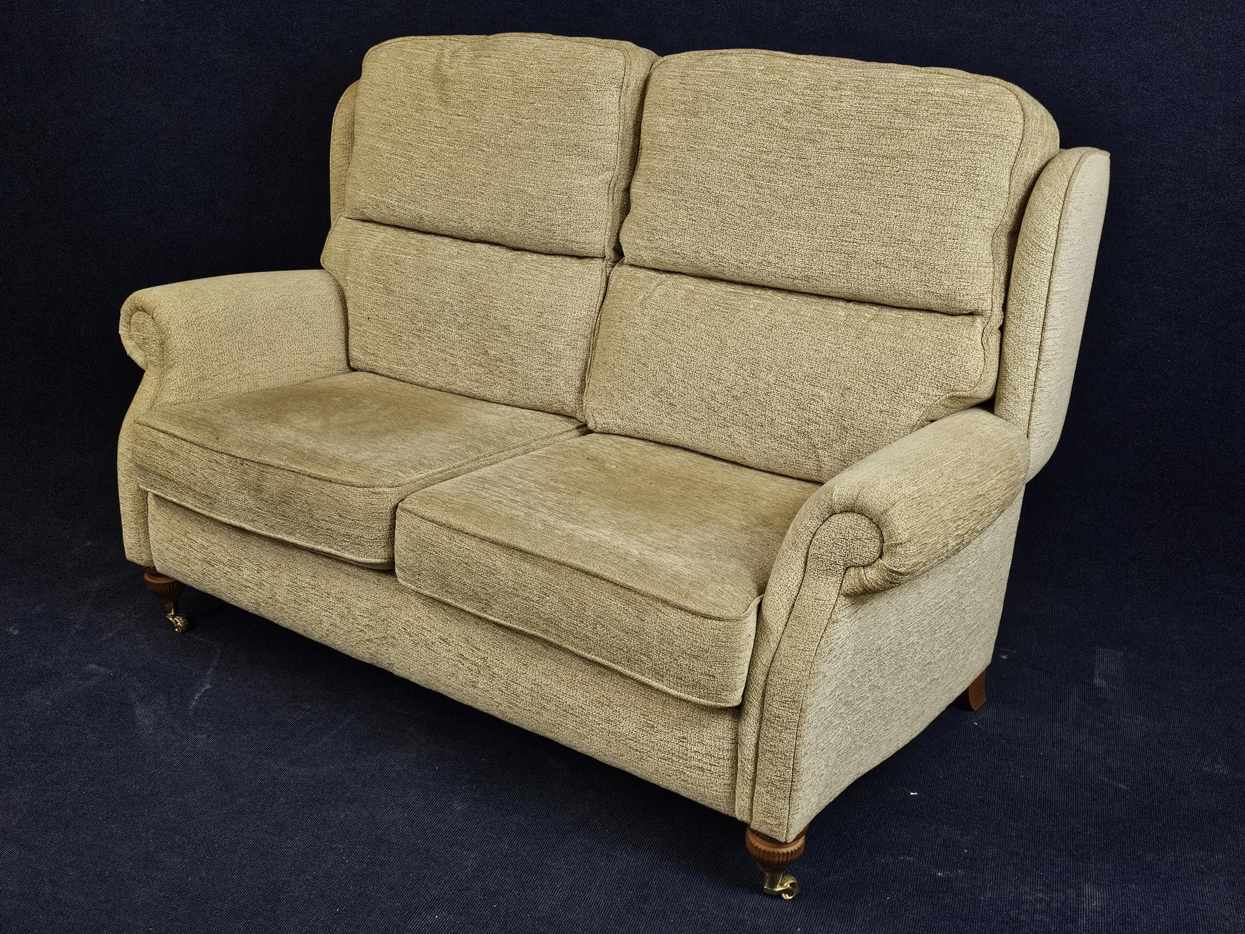 A contemporary sofa on turned supports with brass casters. H.105 W.150 D.90cm. - Image 2 of 3