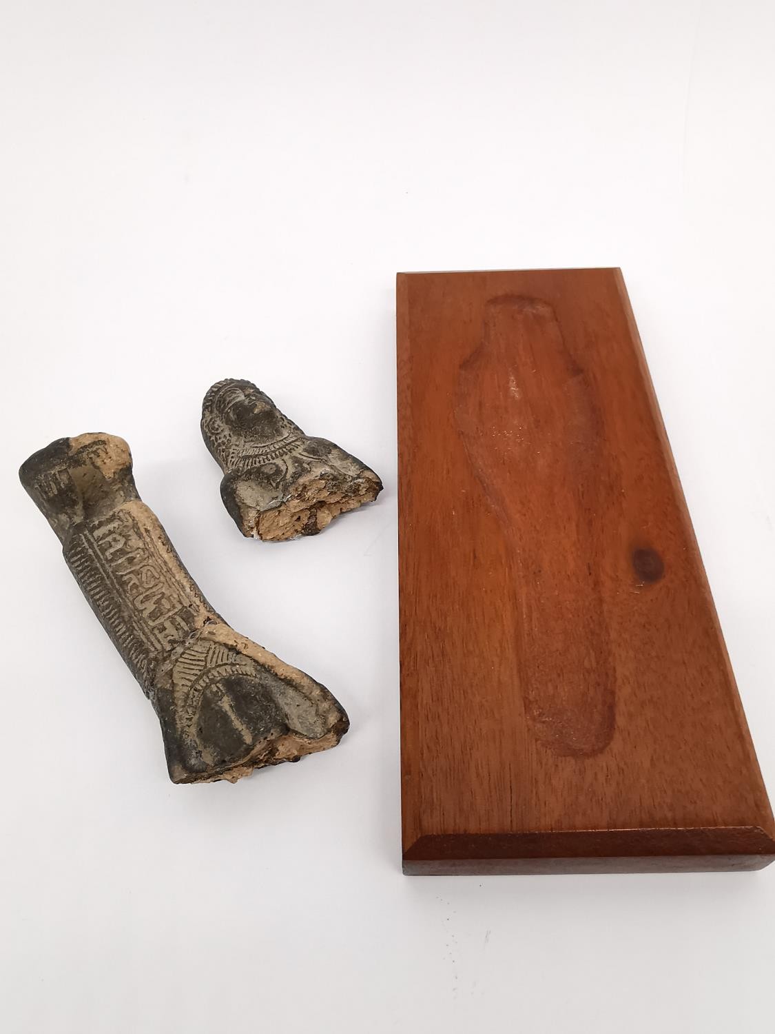 Two Egyptian-style clay ushabti on wooden plinth bases. One lying down and one seated on a - Image 7 of 9