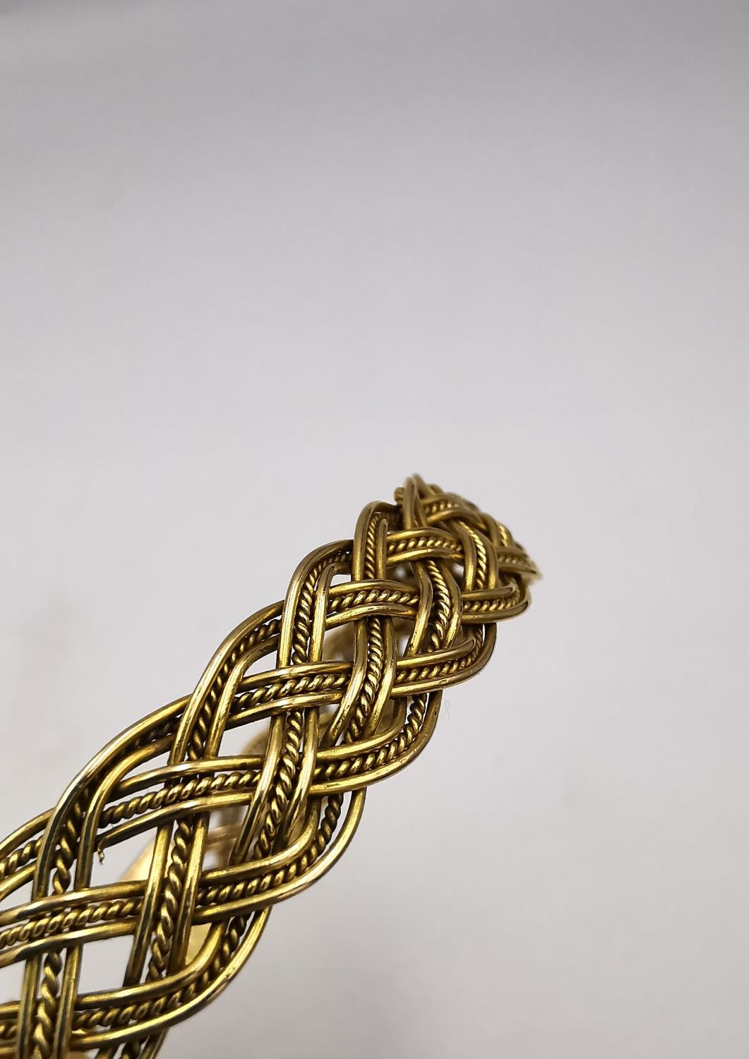 A woven gold plated wirework plaited bracelet with pin fastening. Diameter 6cm. Weight 18.62g. - Image 7 of 10