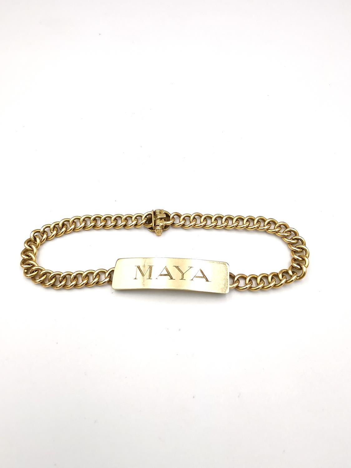 A yellow metal plated curb link identity bracelet, engraved Maya. L.18cm 15.22g