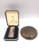 A cased silver Dunhill lighter, marked Made in Switzerland, Dunhill, London with patent LIC USA